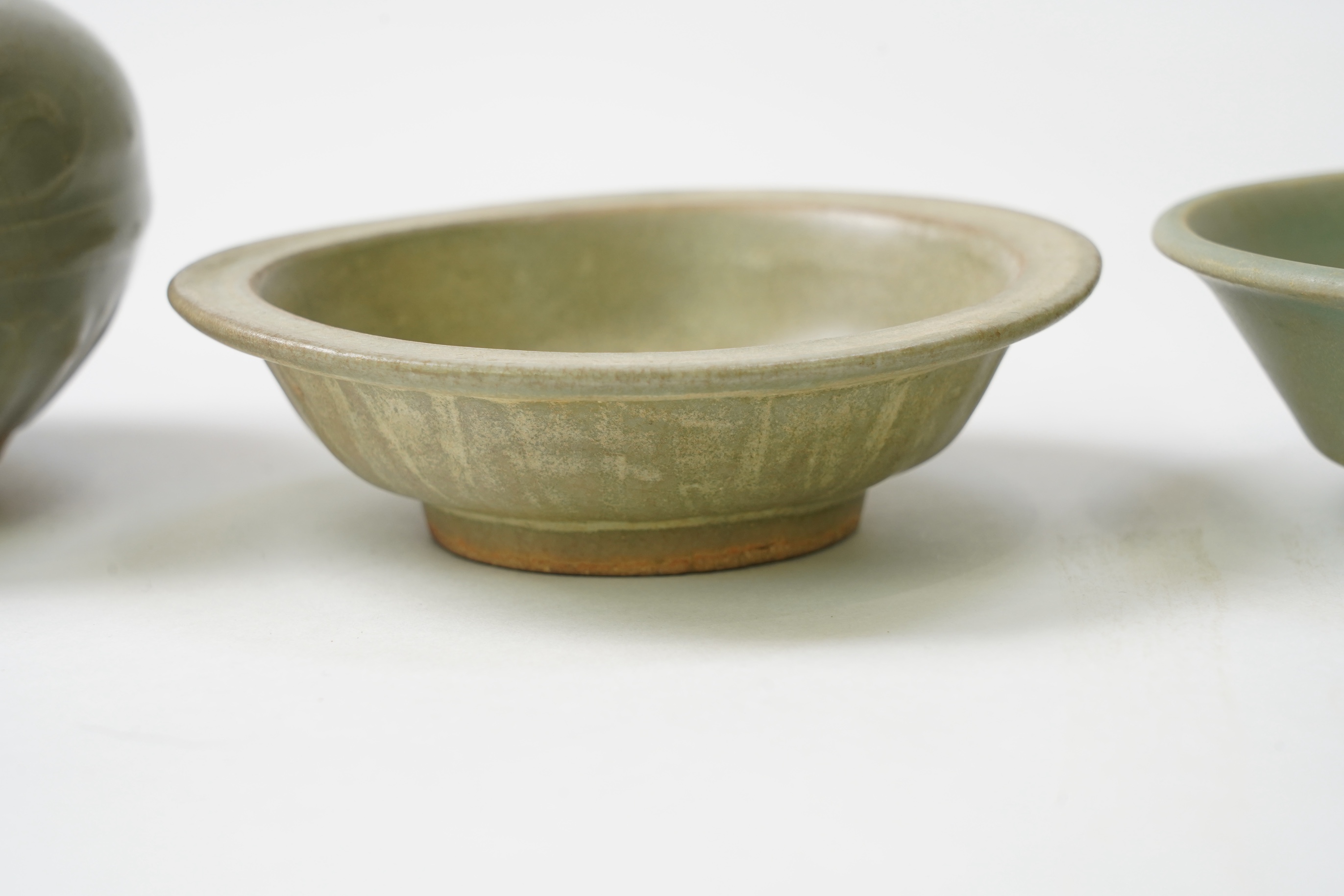 A group of four Chinese Celadon wares - two vases and two dishes, tallest vase 16cm.